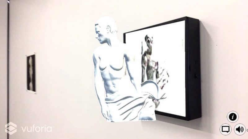 a screenshot from the augmented reality app showing a muscular figure with drapery and short hair coming away from the image it was inspired by.