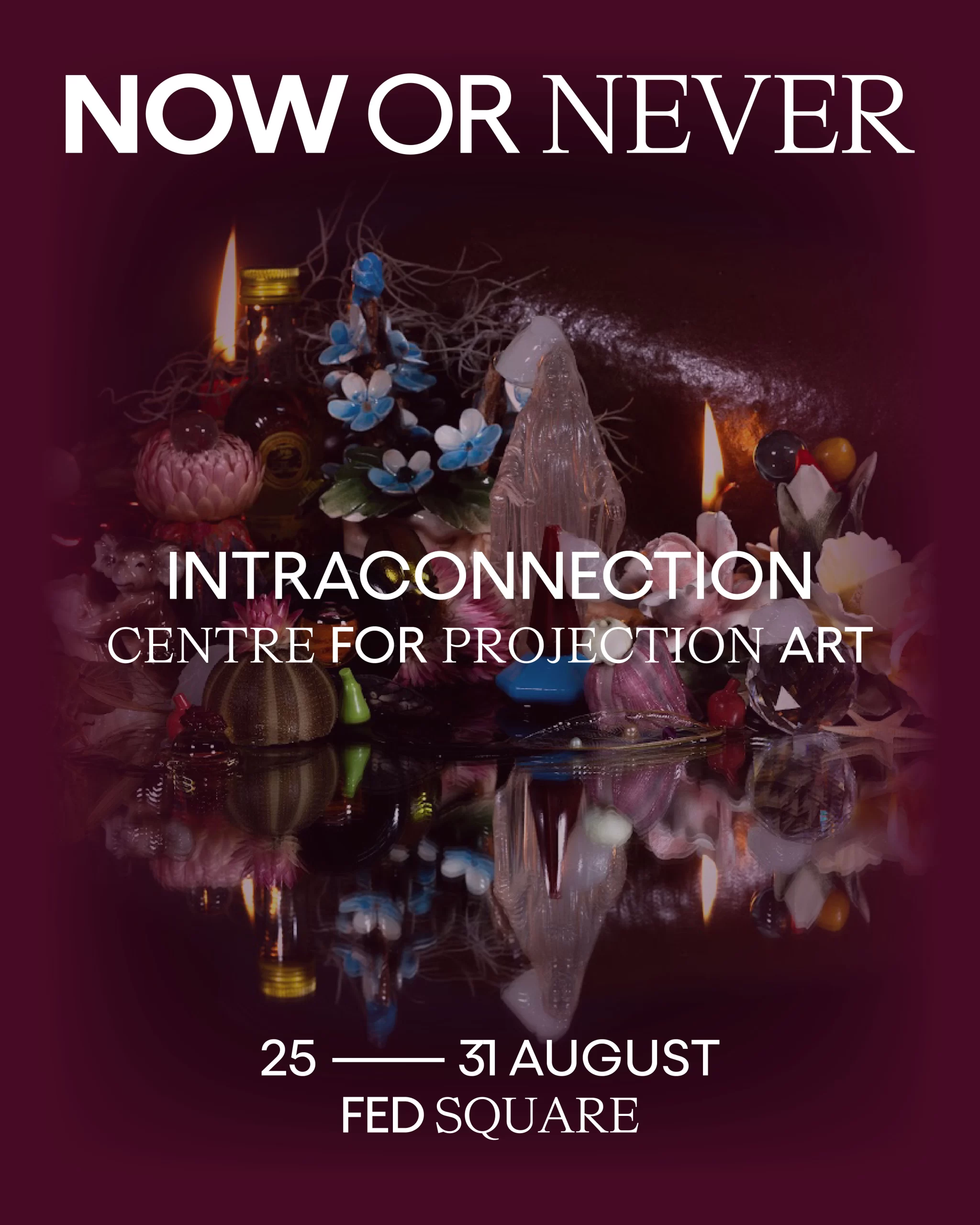 Intraconnection in white on a burgundy background with an assemblage of religious paraphernalia