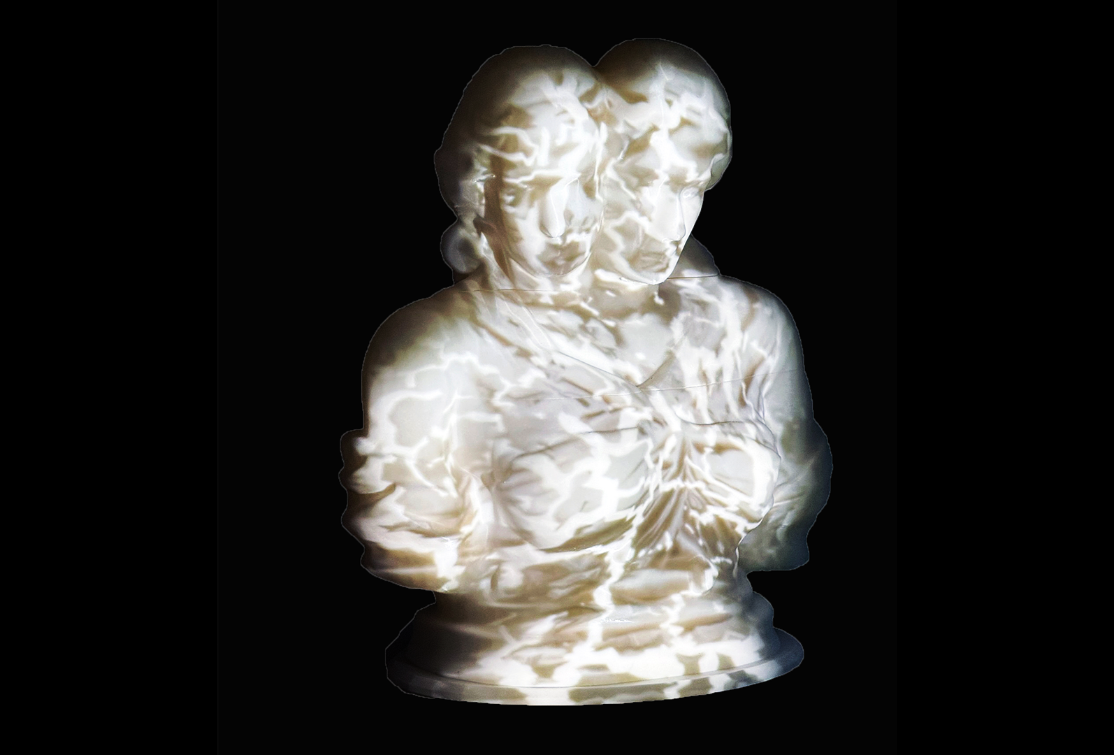 A projection of a cracking Greek marble statue of an AI slop figure with two heads projection mapped onto a 3D printed statue.